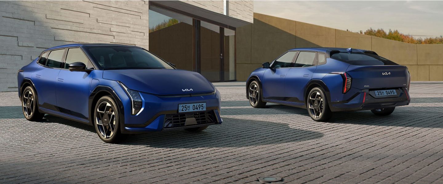 Two blue Kia EV4 sedans parked side by side